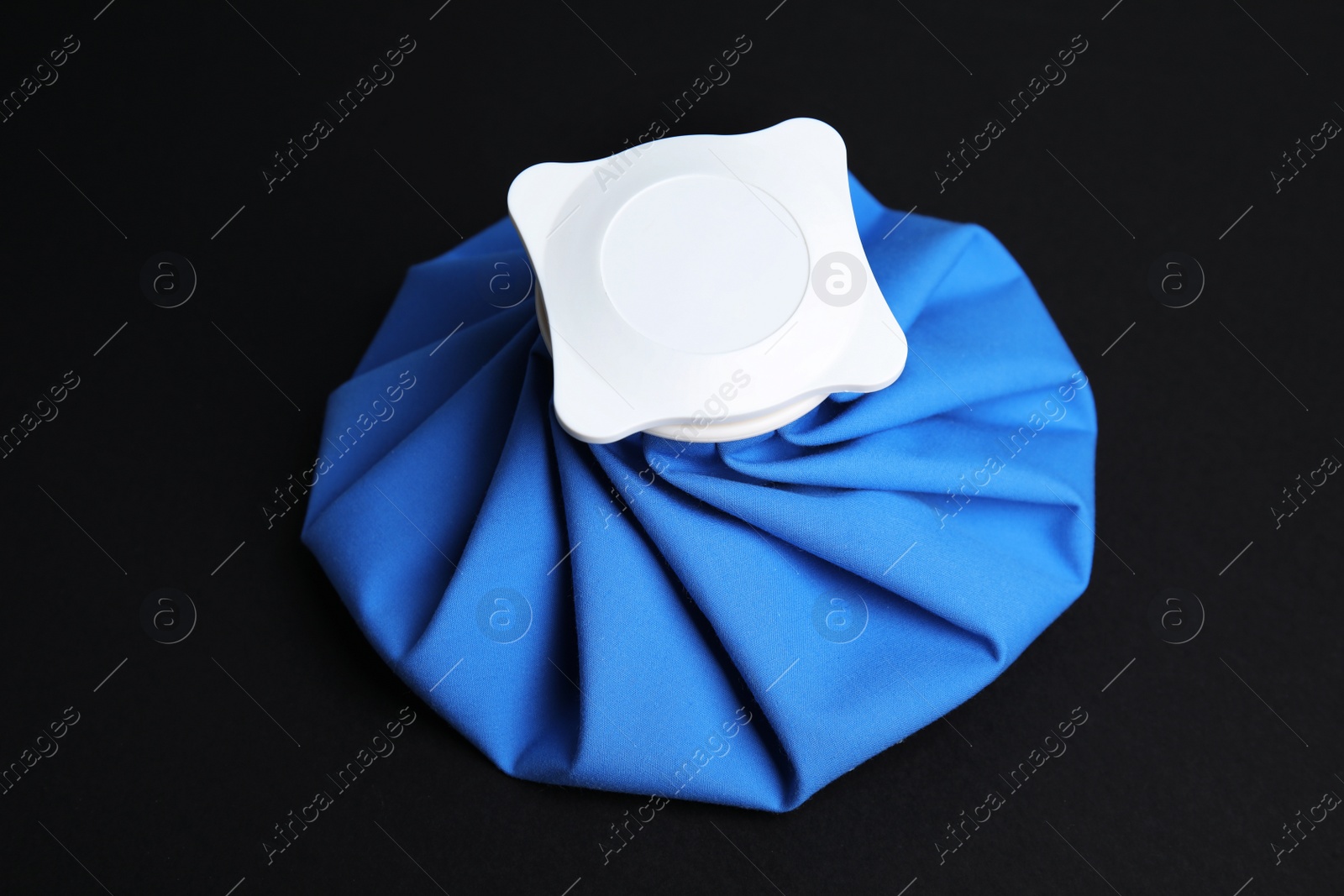 Photo of Ice pack on black background. Cold compress