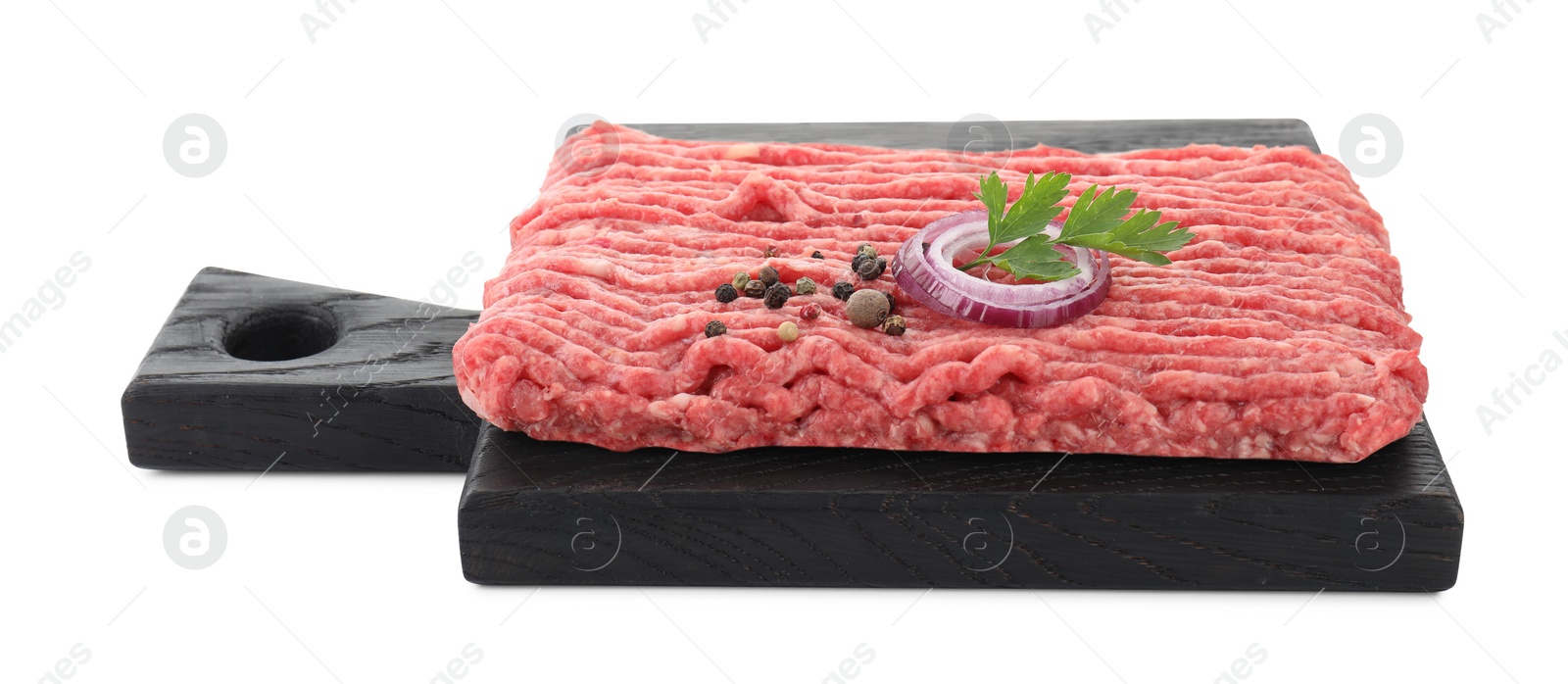 Photo of Board with raw ground meat, onion, peppercorns and parsley isolated on white