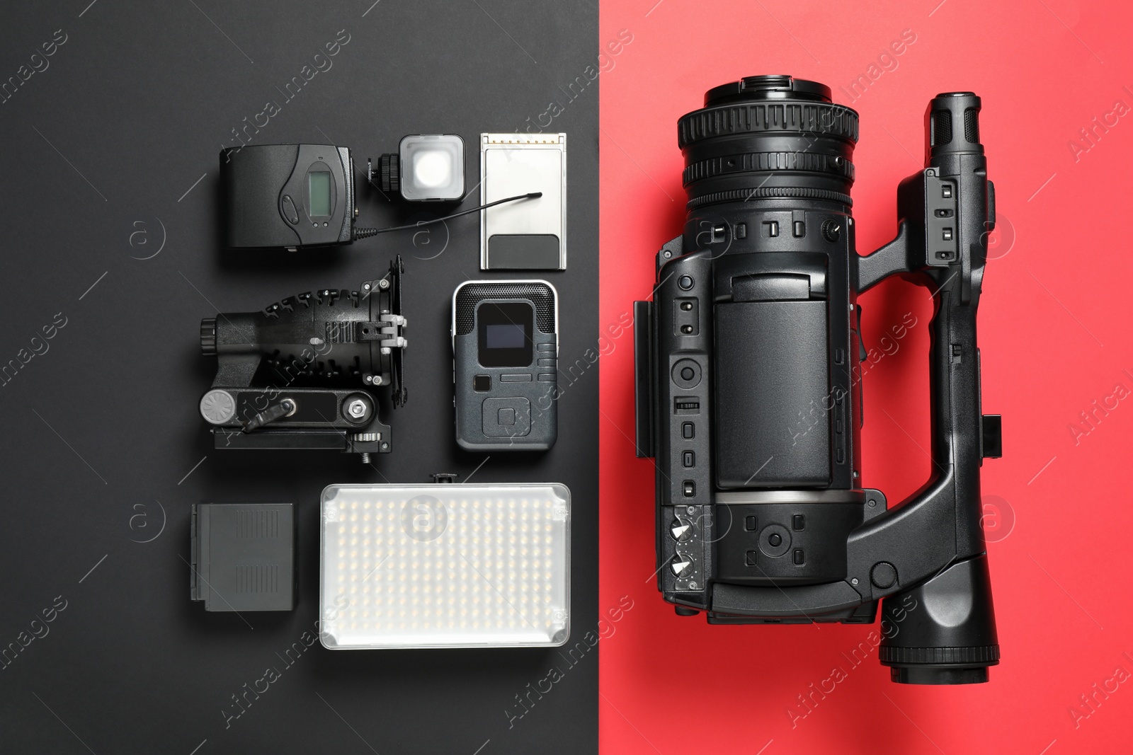 Photo of Flat lay composition with camera and video production equipment on color background