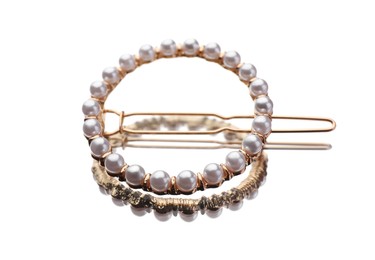 Photo of Elegant hair clip with pearls on mirror surface