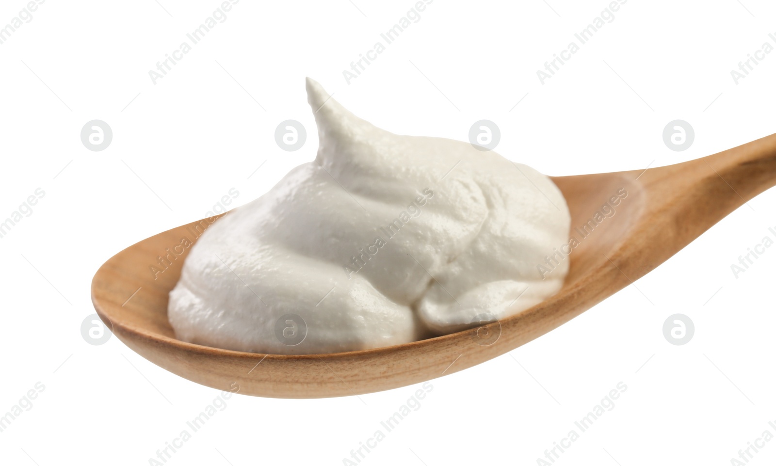 Photo of Wooden spoon with sour cream isolated on white