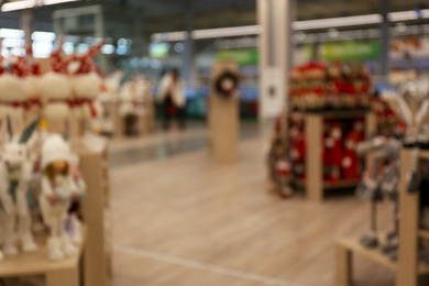 Blurred view of shopping mall interior. Bokeh effect