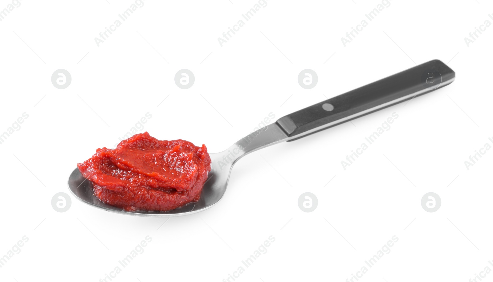 Photo of Spoon of tasty tomato paste isolated on white