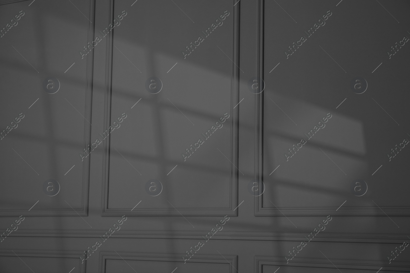 Photo of Shadow from window on dark grey wall indoors