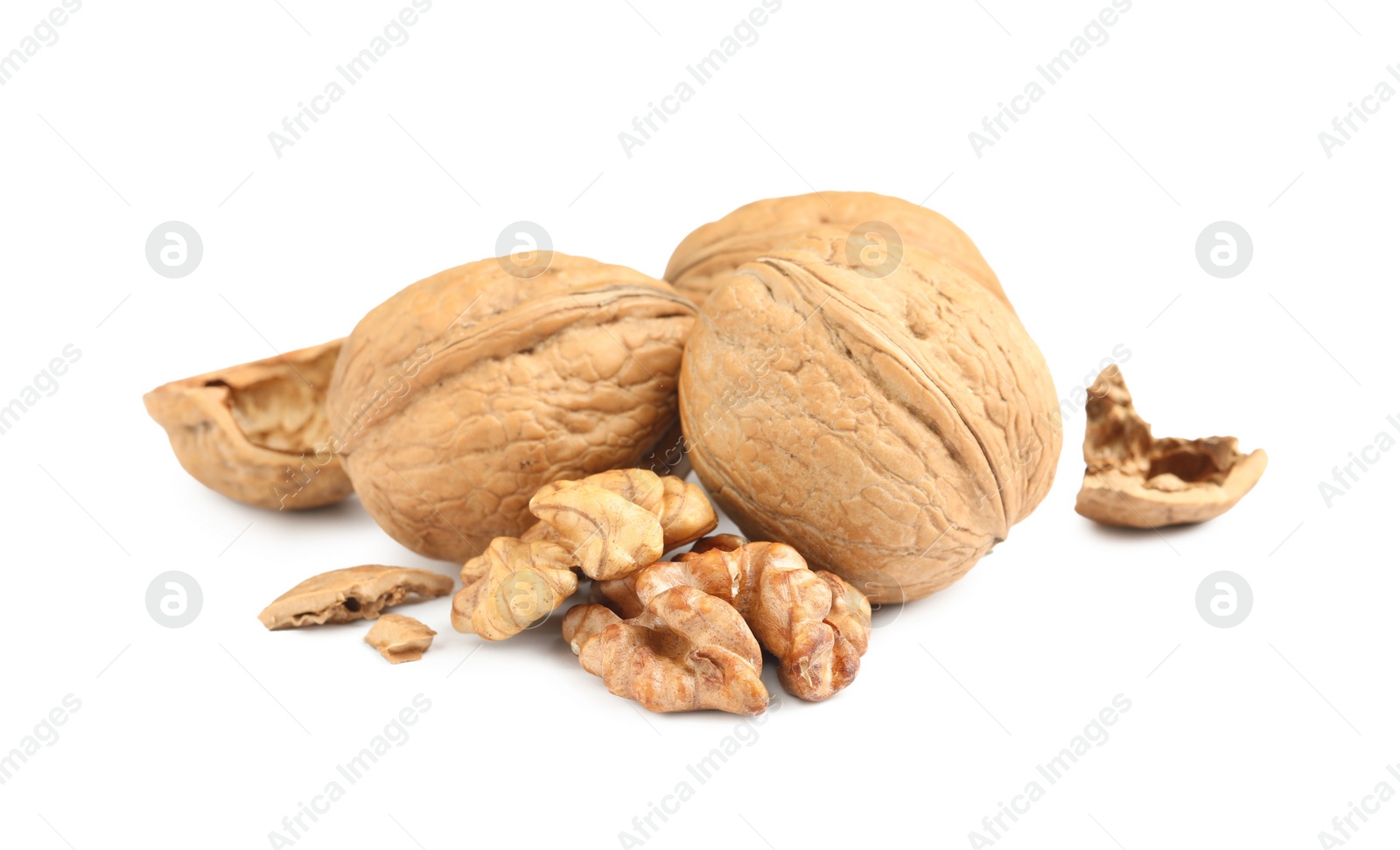 Photo of Fresh ripe walnuts and shell on white background