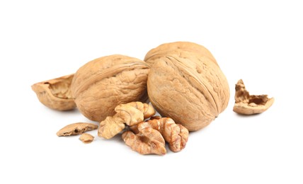 Fresh ripe walnuts and shell on white background