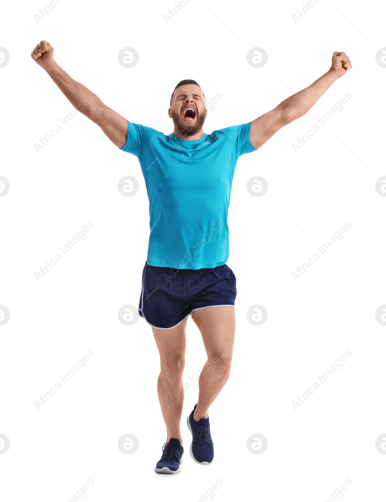 Photo of Young happy man in sportswear running on white background