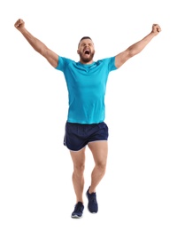 Photo of Young happy man in sportswear running on white background