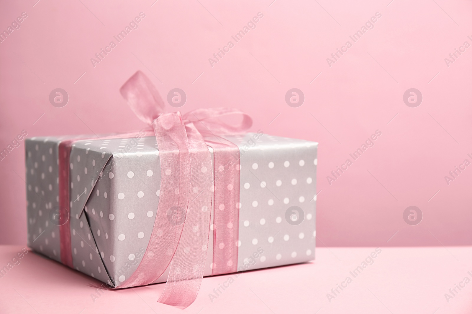 Photo of Elegant gift box for Mother's Day on table