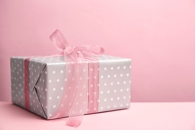 Photo of Elegant gift box for Mother's Day on table