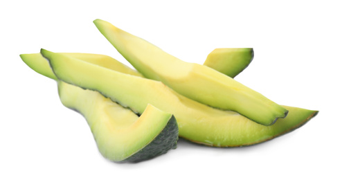 Slices of tasty ripe avocado on white background