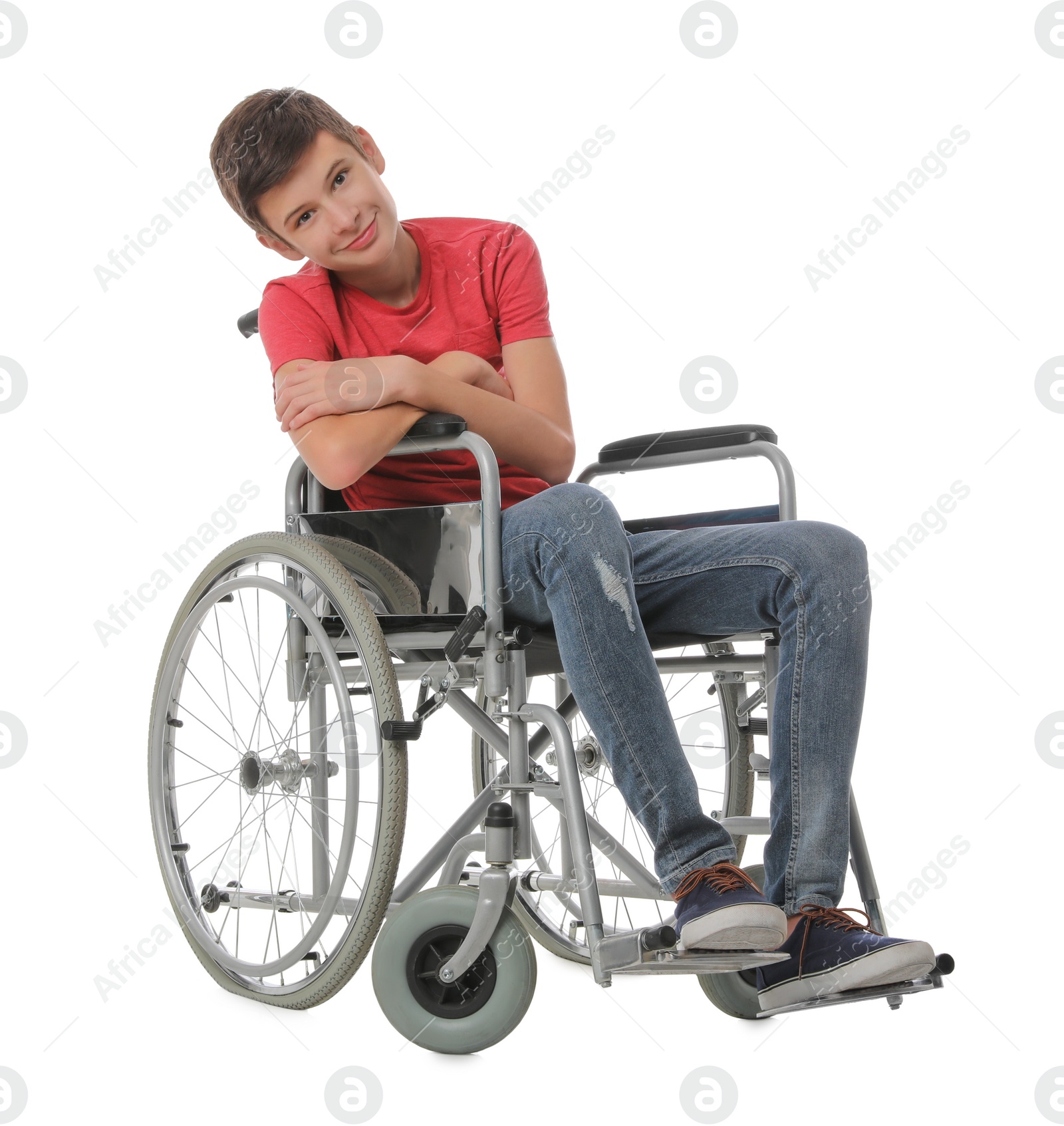 Photo of Teen boy in wheelchair on white background