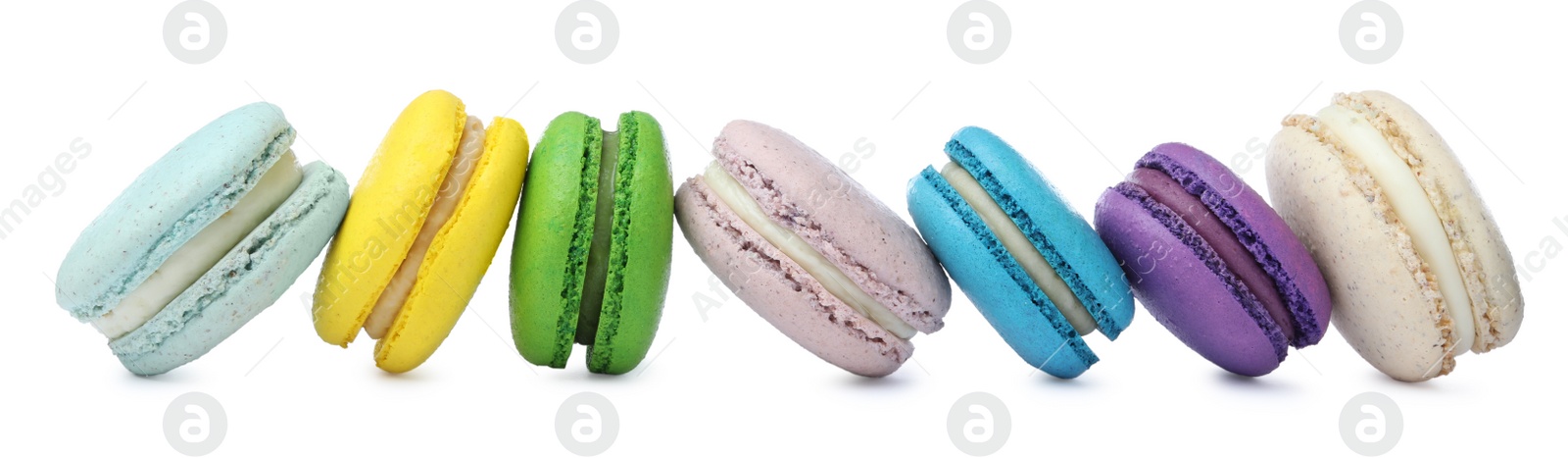 Photo of Different delicious colorful macarons on white background