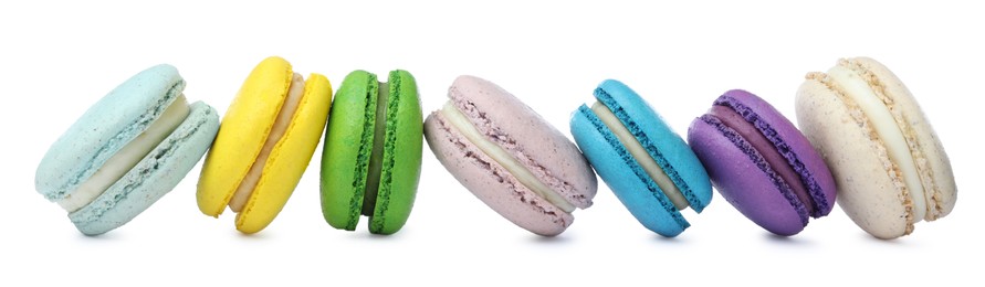 Photo of Different delicious colorful macarons on white background