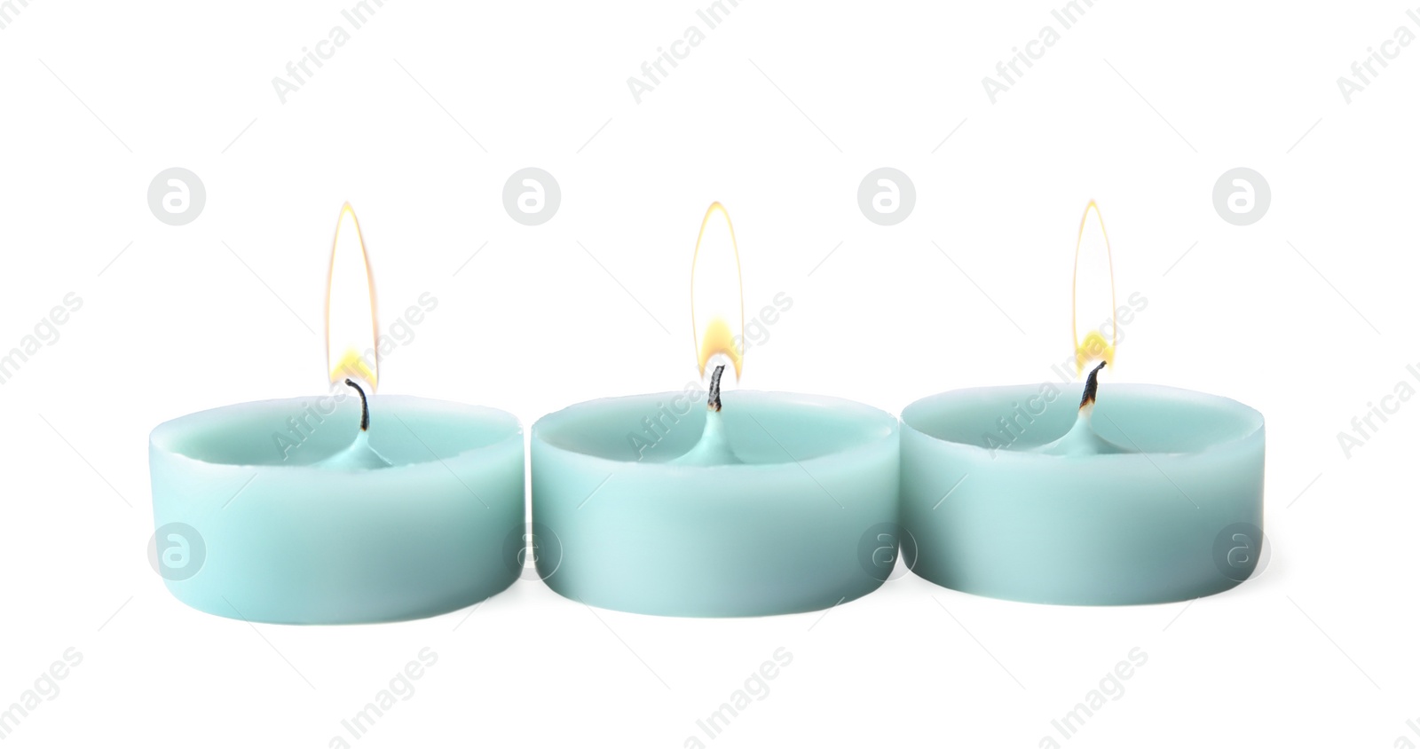 Photo of Light blue wax decorative candles isolated on white
