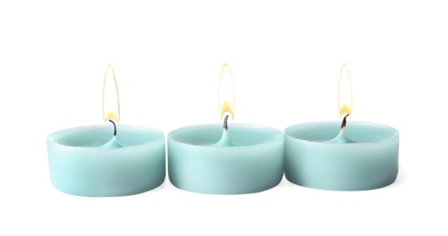 Photo of Light blue wax decorative candles isolated on white