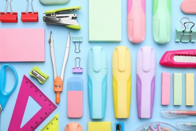 Many different school stationery on light blue background, flat lay. Back to school