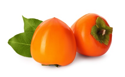 Delicious ripe juicy persimmons on white background