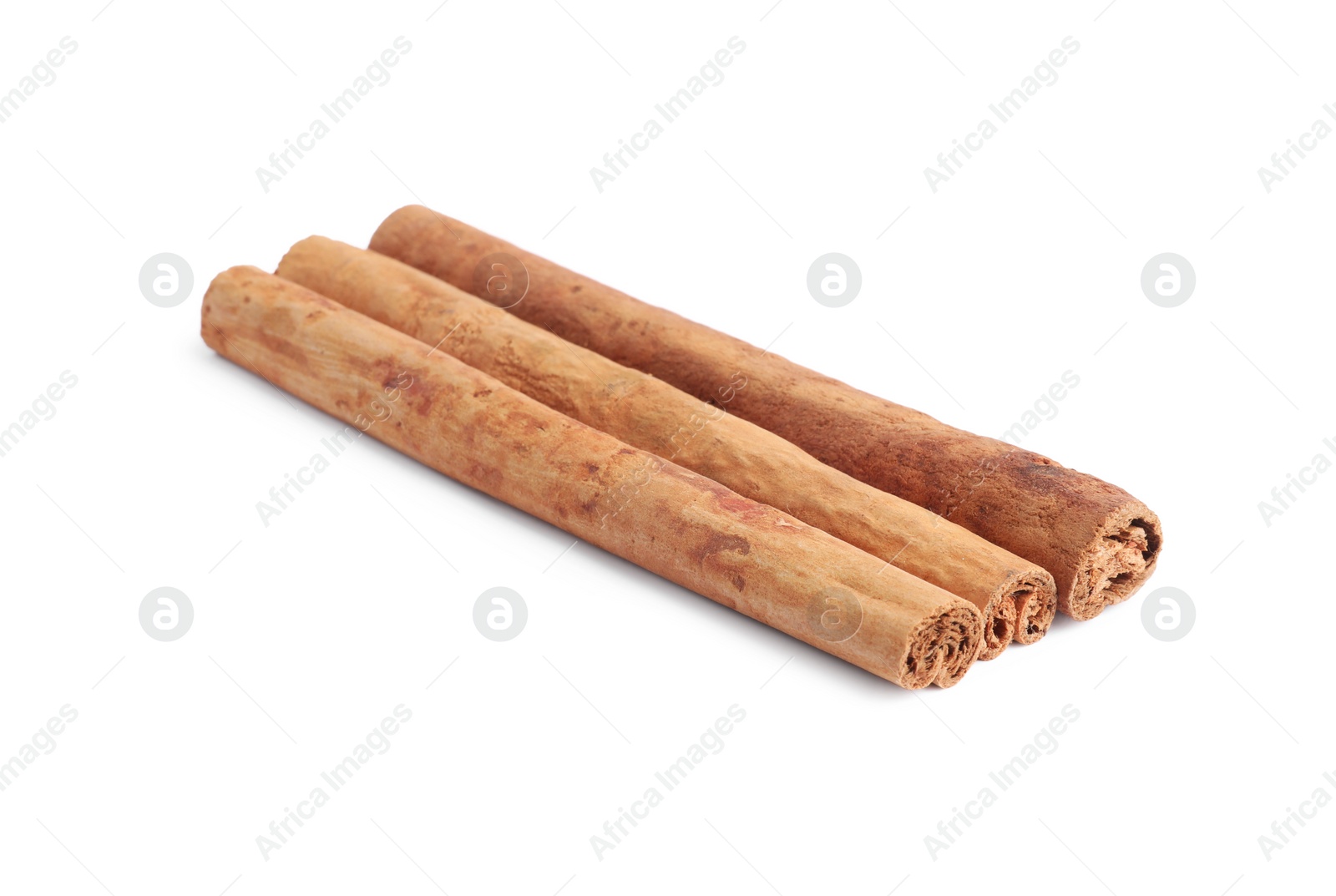 Photo of Dry aromatic cinnamon sticks isolated on white