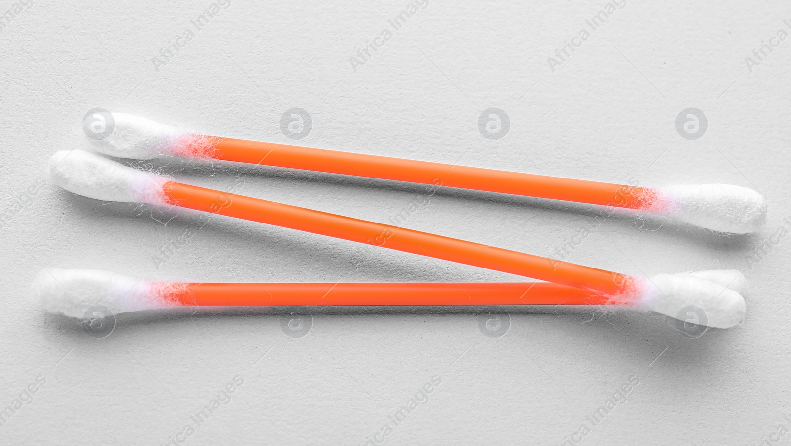 Photo of Clean cotton buds on white background, top view. Hygienic accessory