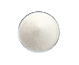 Granulated sugar in bowl isolated on white, top view