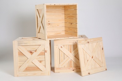 Photo of Group of wooden crates on grey background