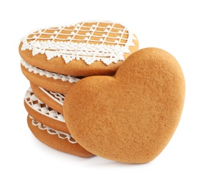 Photo of Tasty heart shaped gingerbread cookies isolated on white