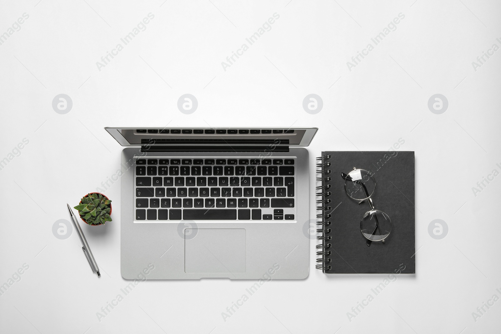 Photo of Flat lay composition with laptop on white background
