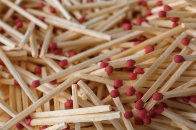 Photo of Pile of wooden matches as background, closeup