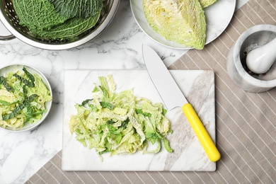 Photo of Flat lay composition with savoy cabbage on table