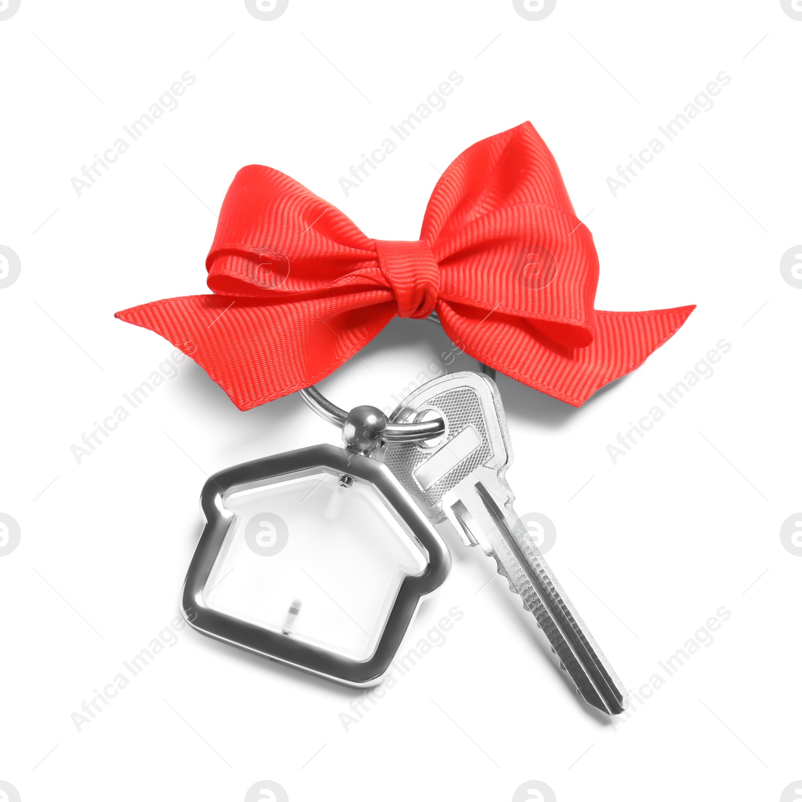 Photo of House key with trinket and bow on white background