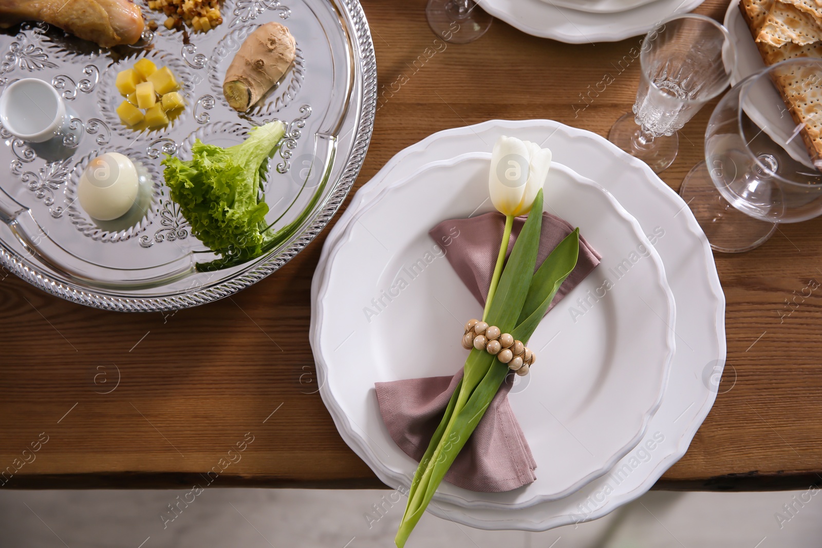 Photo of Festive Passover table setting, top view. Pesach celebration