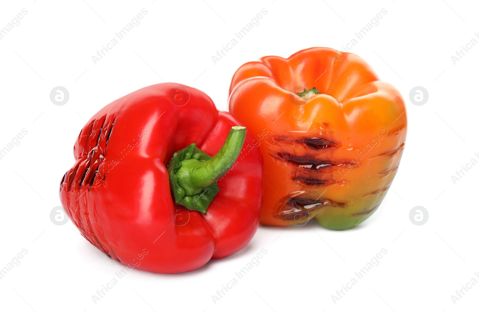 Photo of Grilled ripe paprika peppers on white background