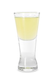 Photo of Shot glass with tasty limoncello liqueur isolated on white