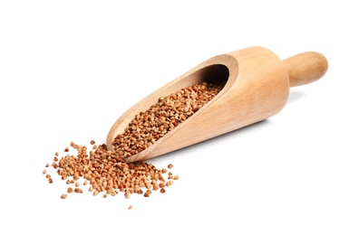 Photo of Scoop with uncooked buckwheat on white background