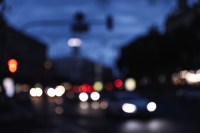 Photo of Blurred view of modern city at evening. Bokeh effect