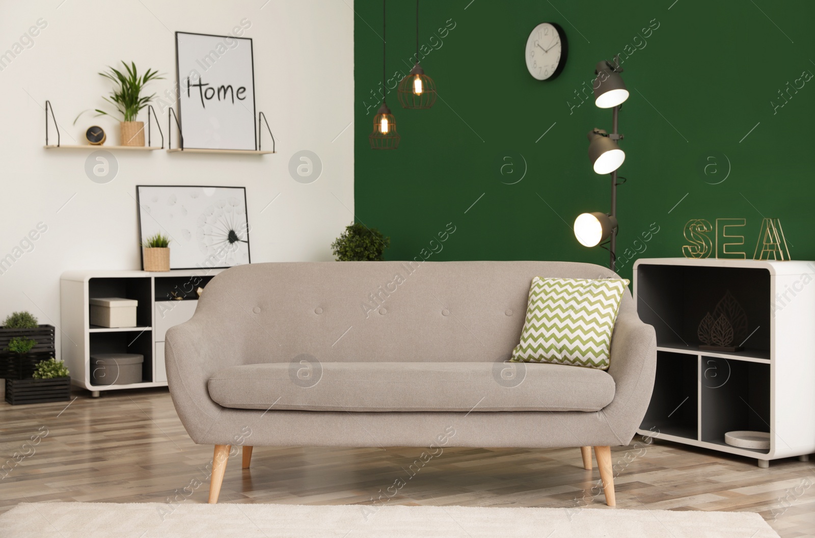 Photo of Modern interior of living room with stylish sofa. Contemporary design