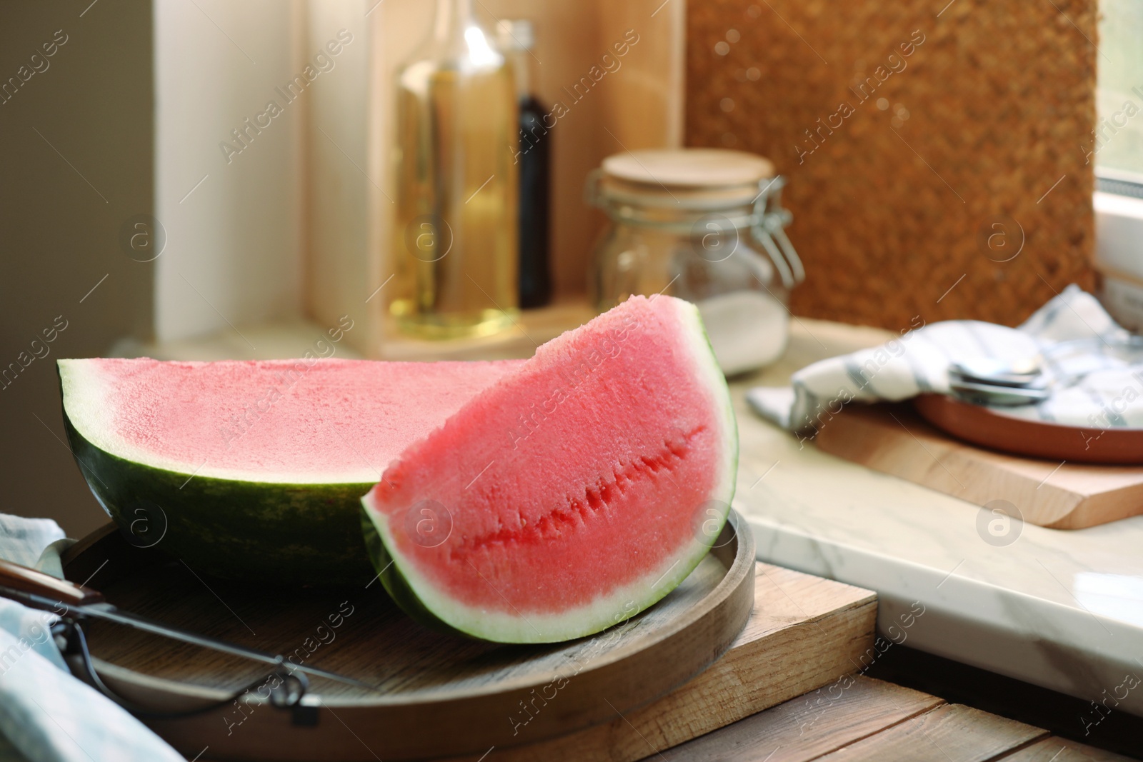 Photo of Sliced fresh juicy watermelon on wooden table