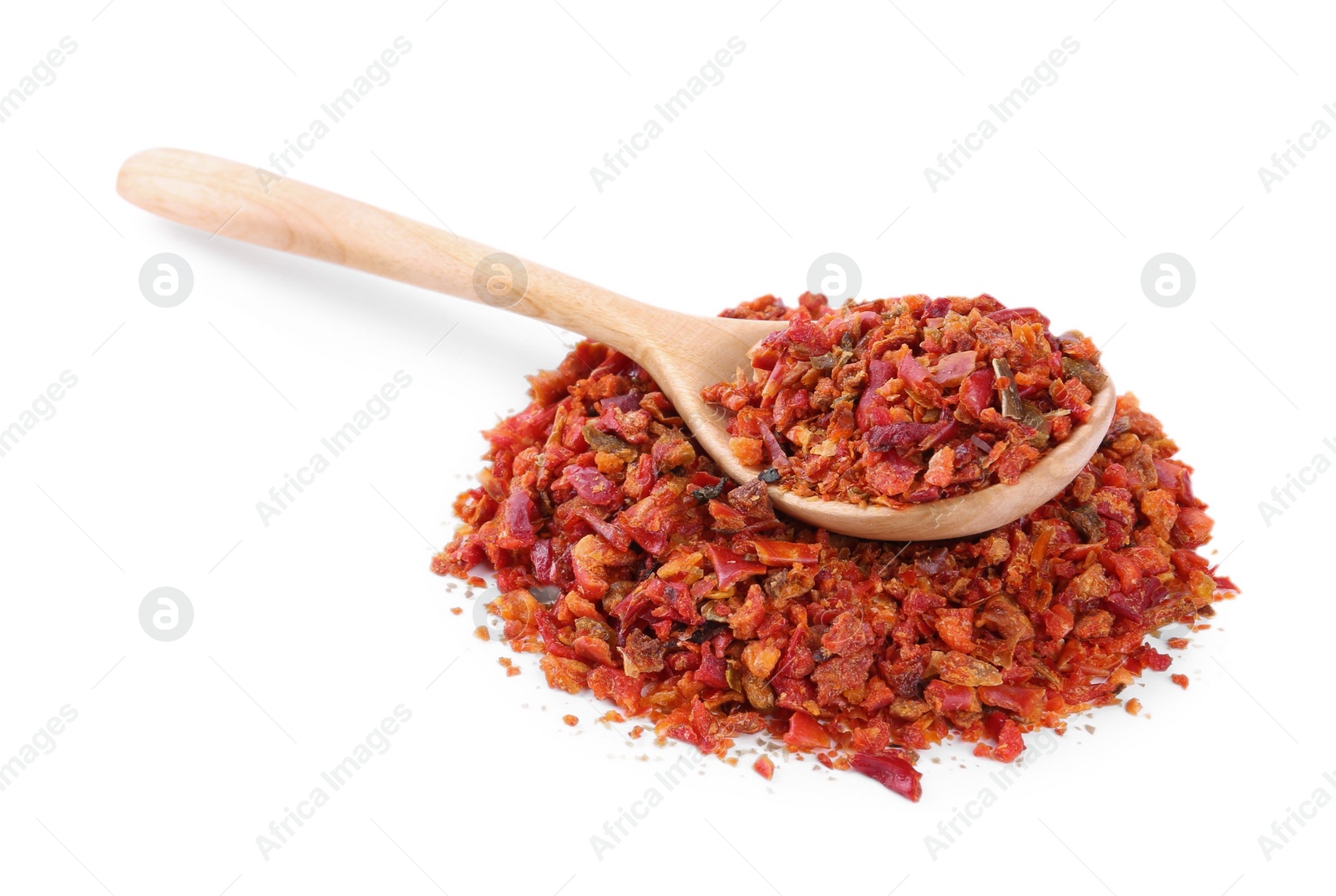 Photo of Aromatic spice. Red chili pepper flakes and spoon isolated on white