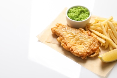 Photo of British Traditional Fish and potato chips on white background