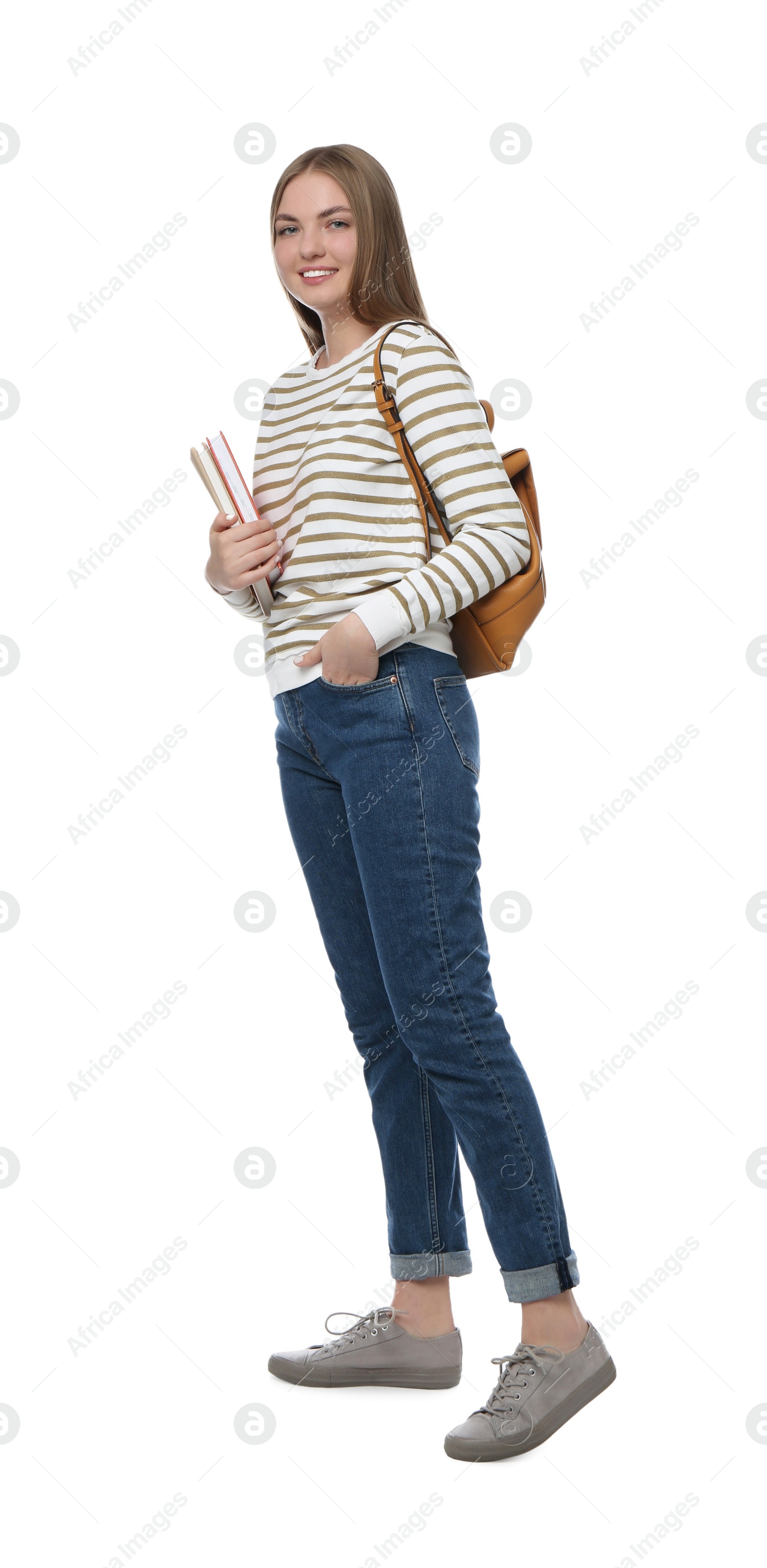 Photo of Teenage student with backpack and books on white background