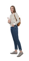 Teenage student with backpack and books on white background