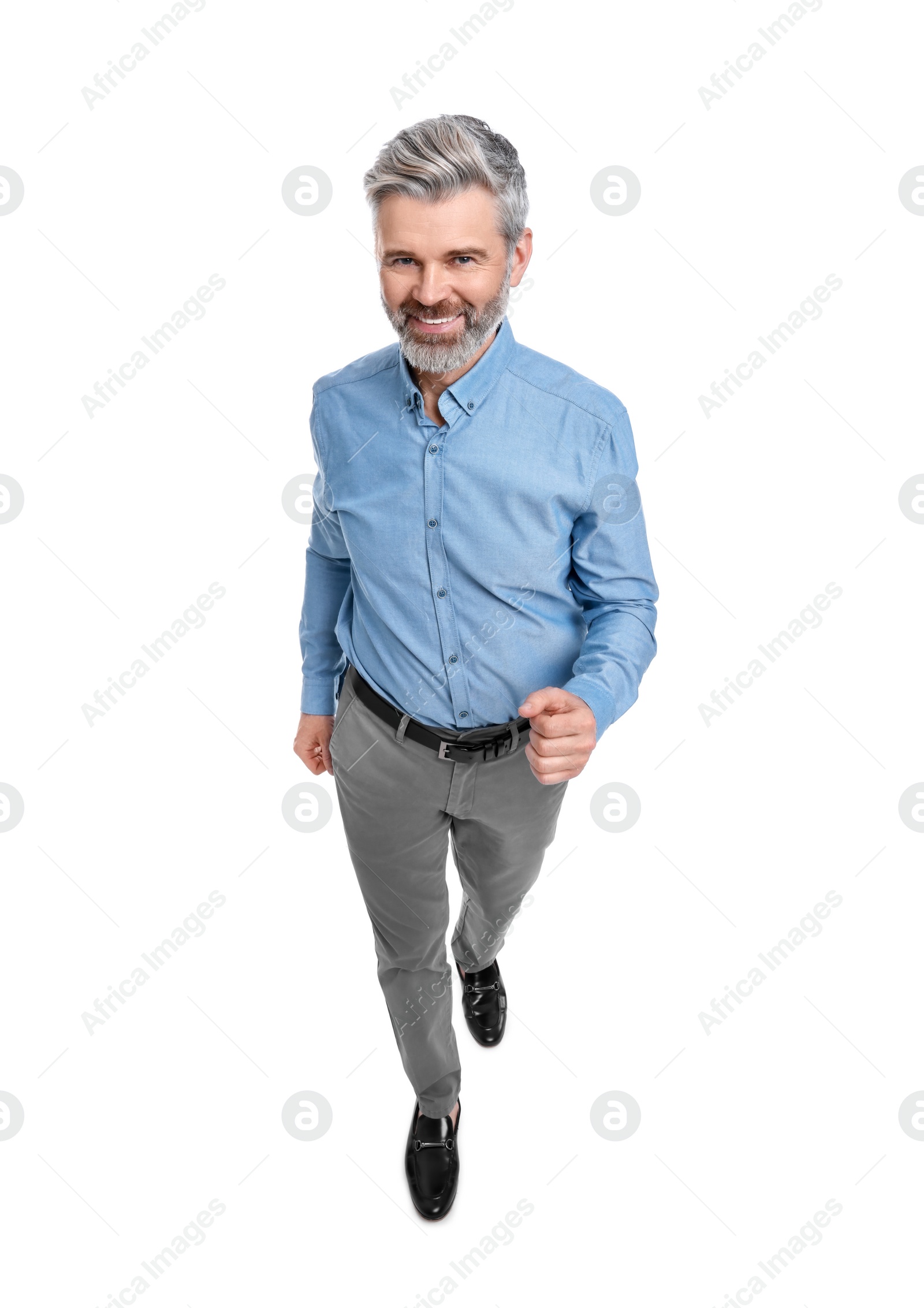 Photo of Mature businessman in stylish clothes posing on white background, above view