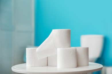 Photo of Toilet paper rolls on table in bathroom