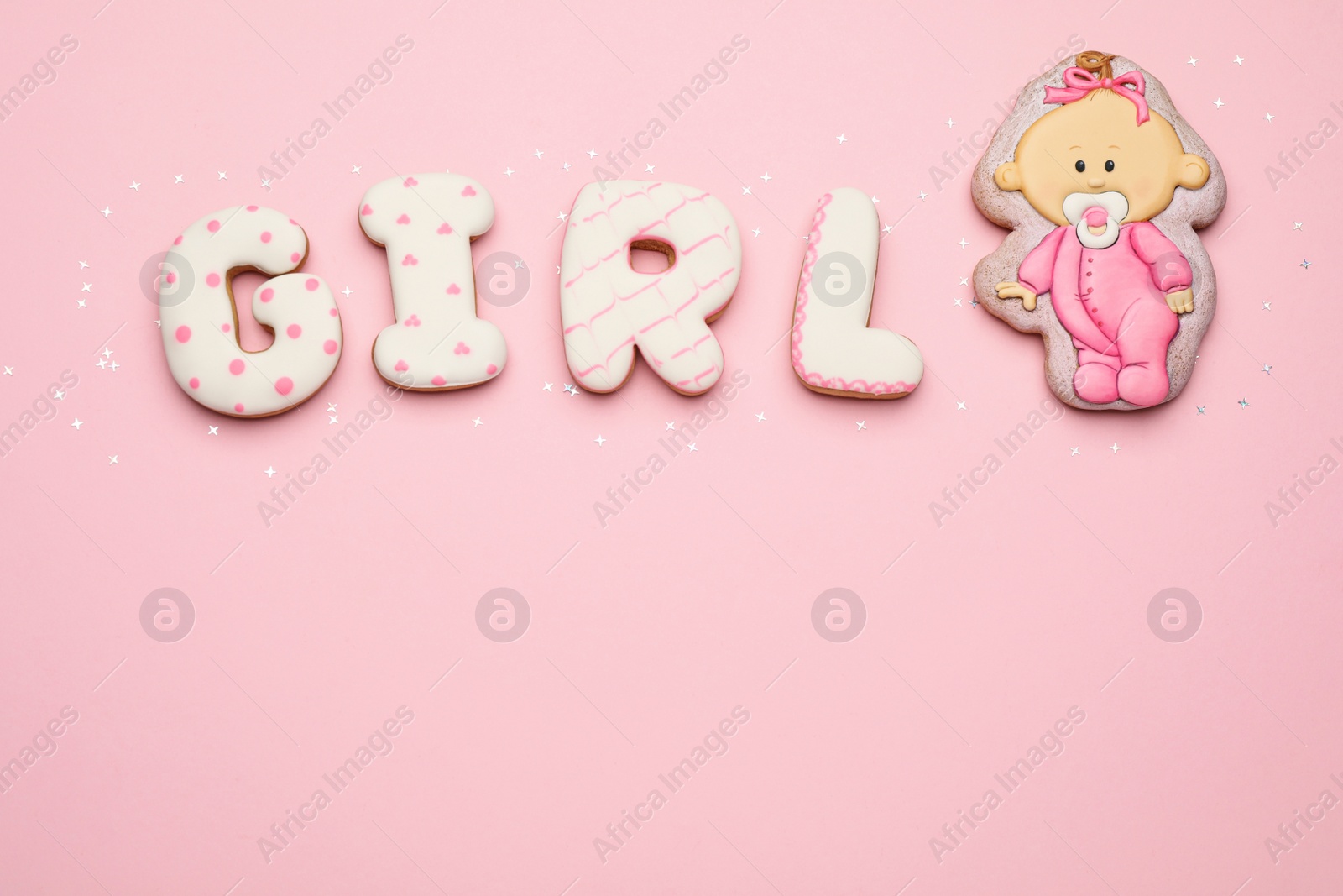 Photo of Word GIRL made of tasty cookies on pink background, flat lay with space for text. Baby shower party