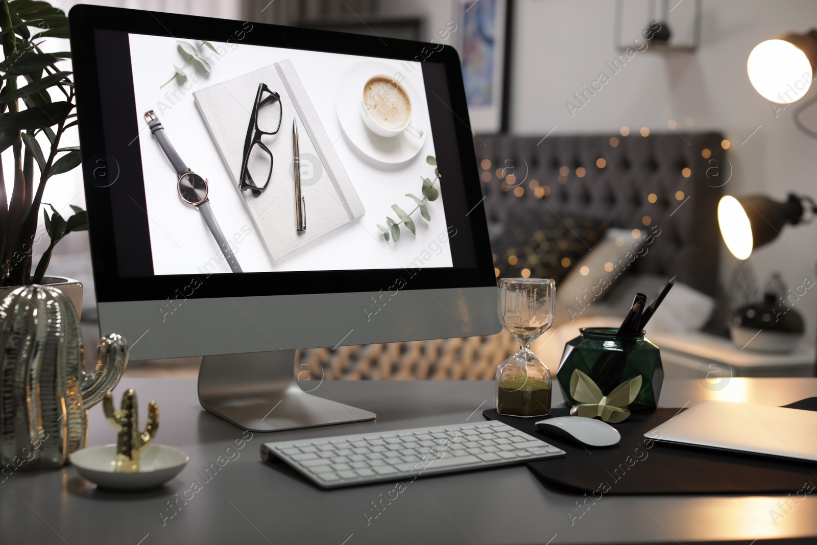 Photo of Stylish workplace interior with modern computer on desk