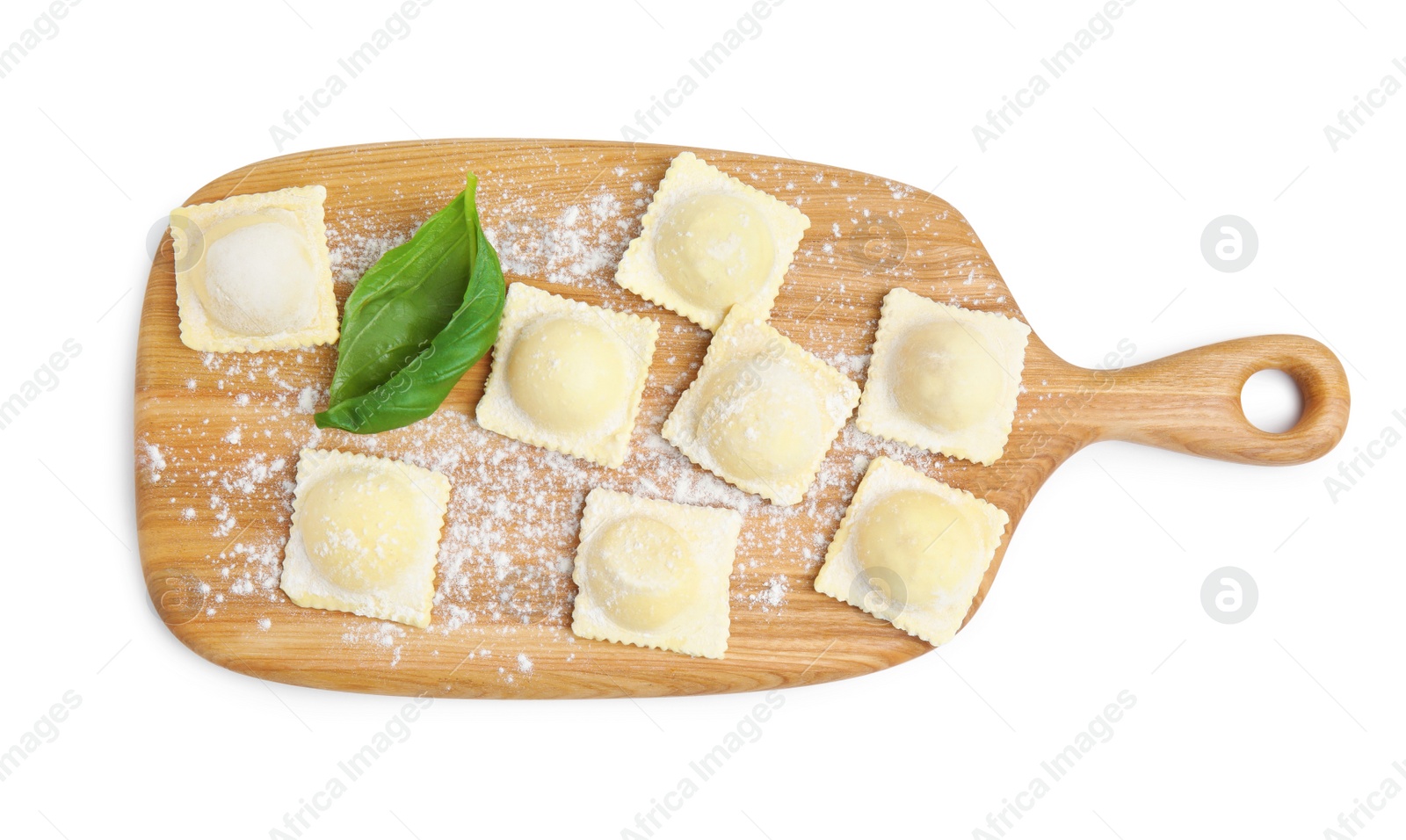 Photo of Wooden board with raw ravioli on white background, top view