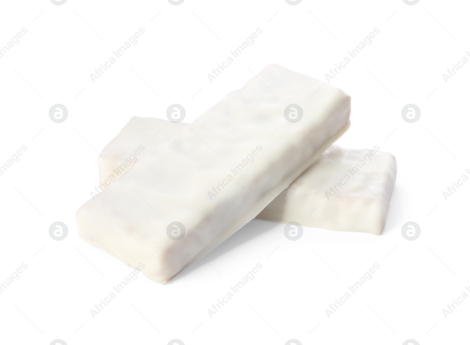 Image of Crunchy granola bars covered with icing on white background