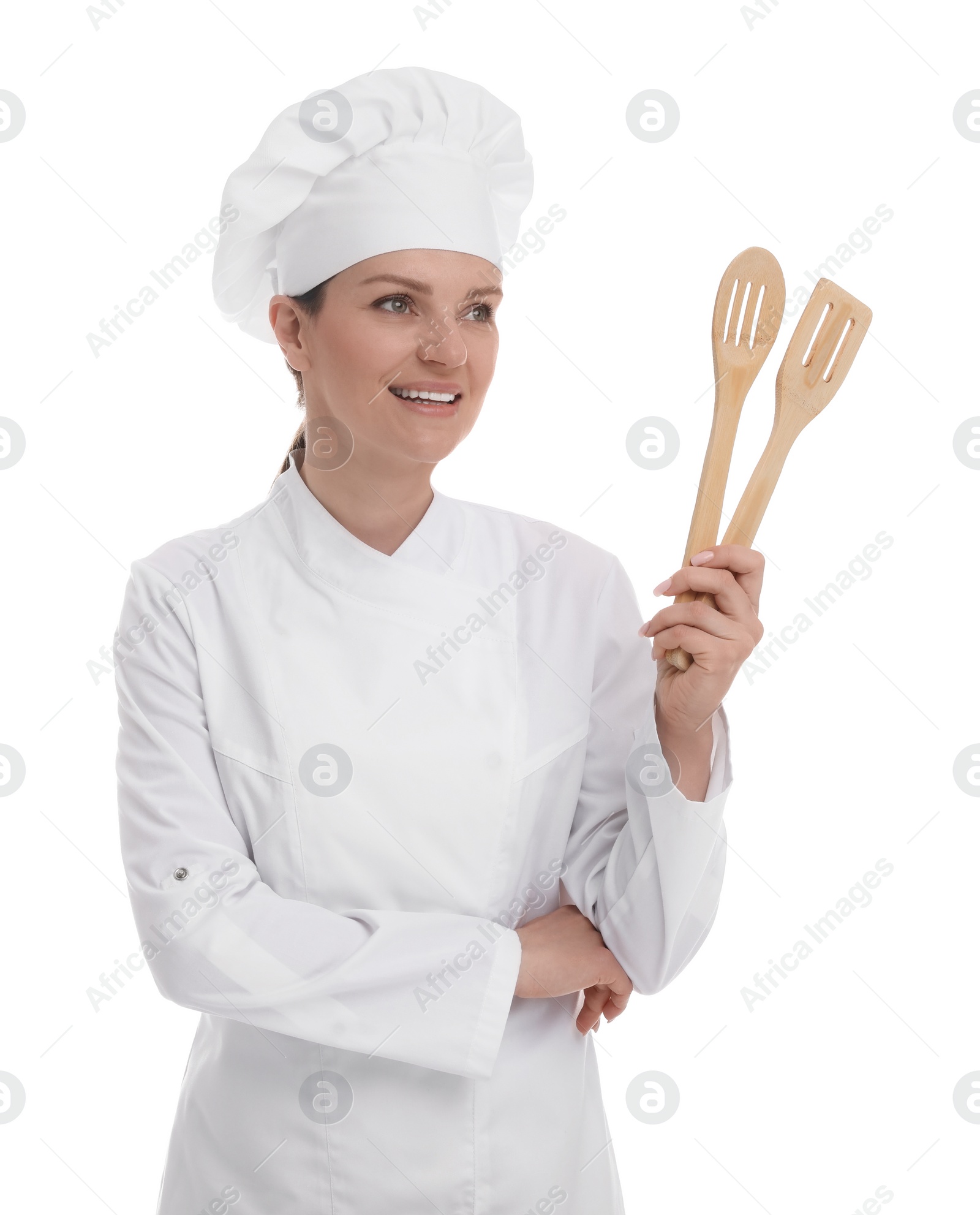 Photo of Happy woman chef in uniform holding wooden spatulas on white background