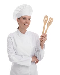 Photo of Happy woman chef in uniform holding wooden spatulas on white background